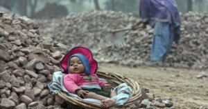 Baby in basket in construction site